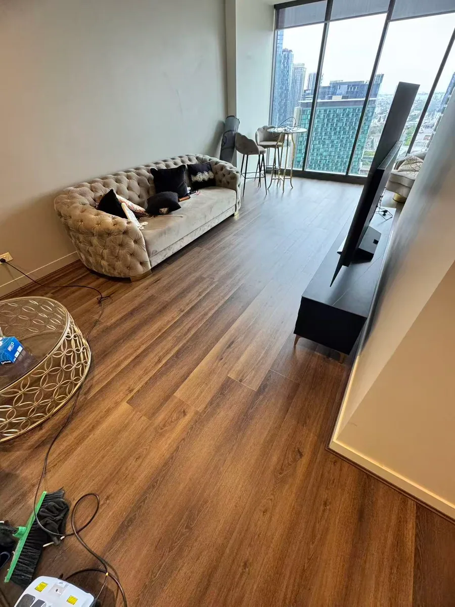 Owner-supplied photo of flooring across a furnished living area